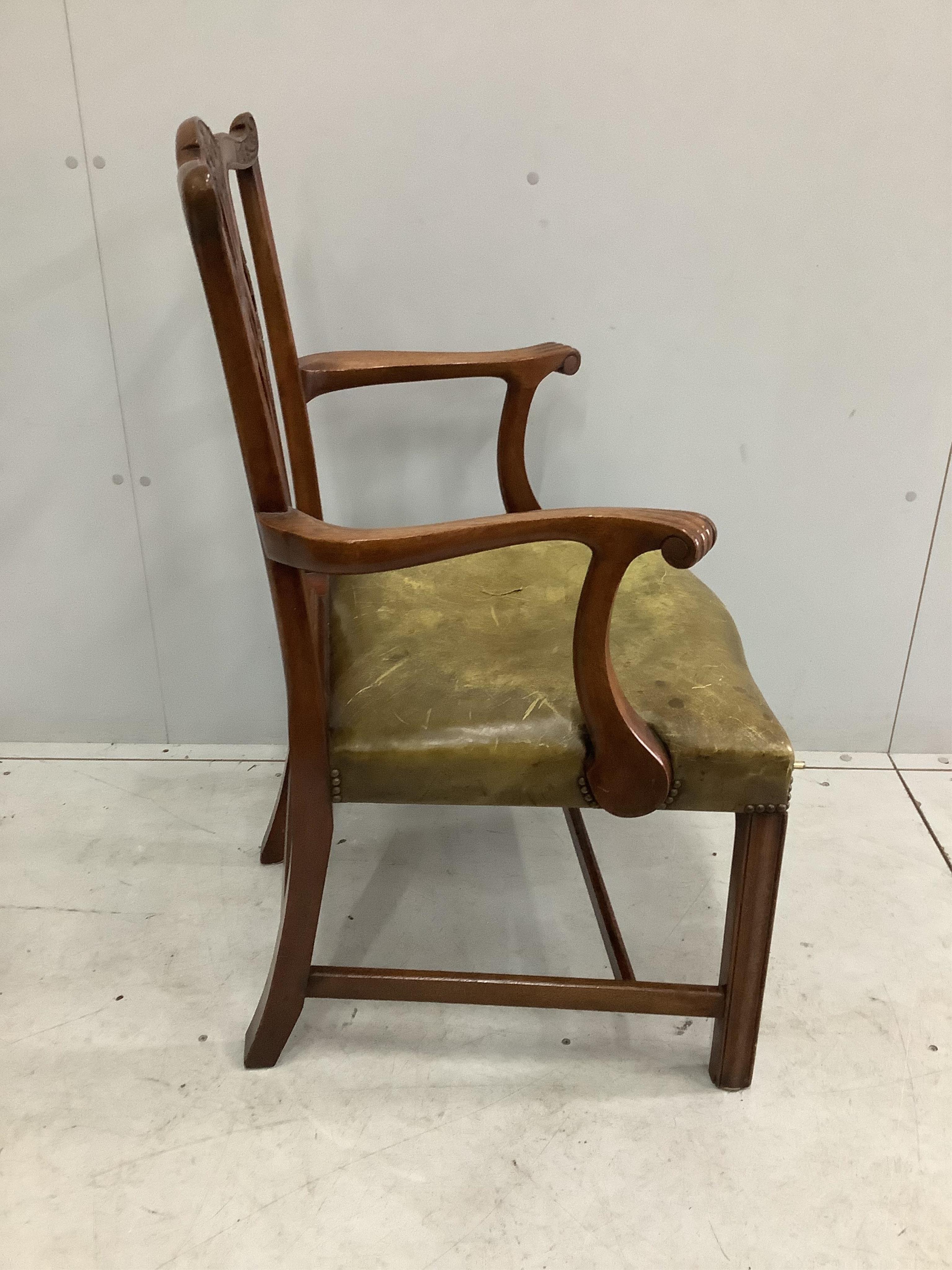 A set of eight reproduction Chippendale style mahogany dining chairs with green leather seats, two with arms. Condition - fair to good